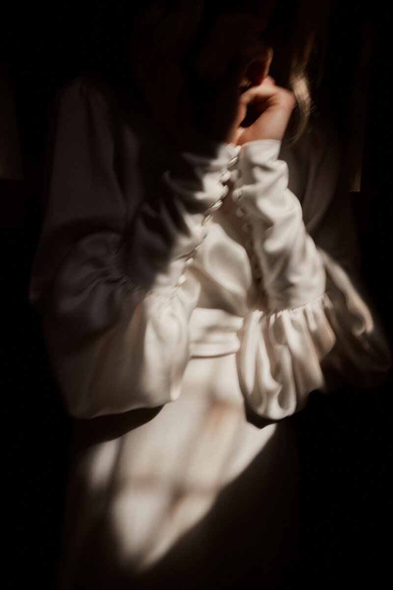 Ruffled sleeves on wedding dress, in silk by British bridal gown designer
