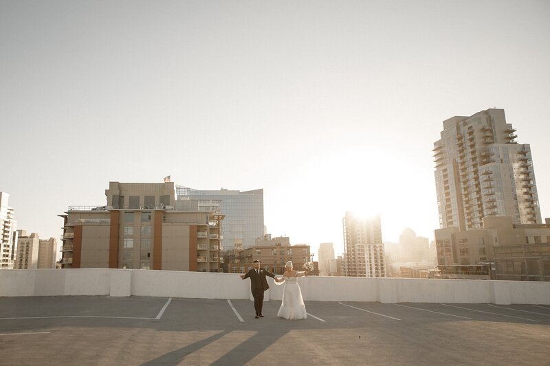 bride and groom dance on san diego rooftop after wedding ceremony