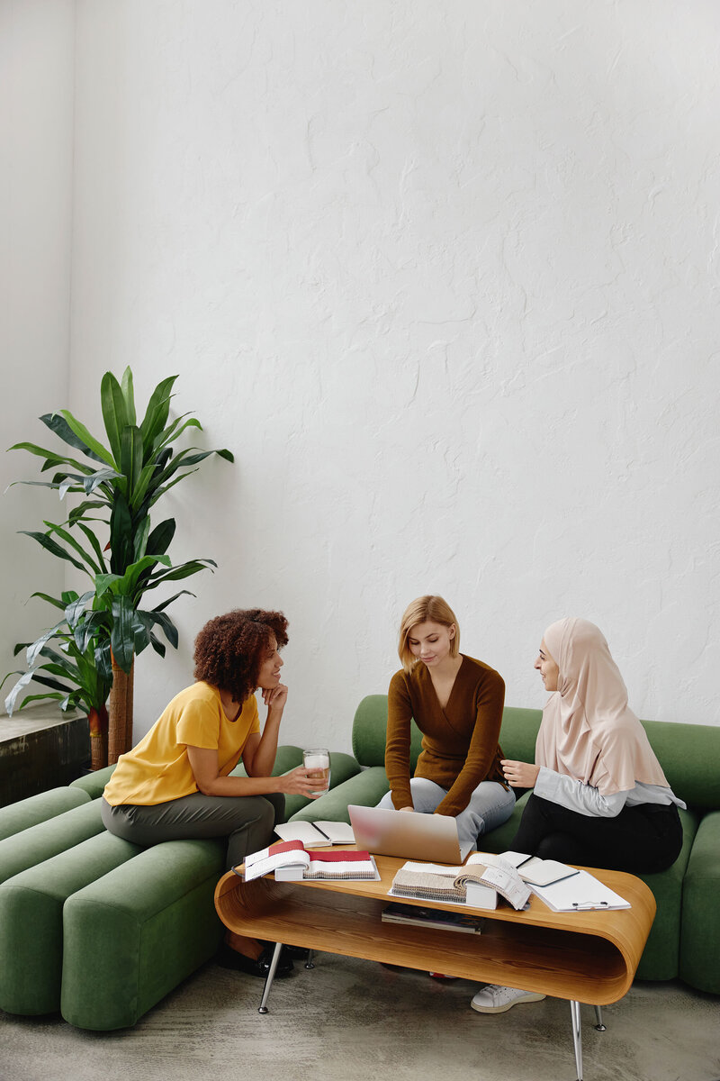 women sitting around coffee table talking