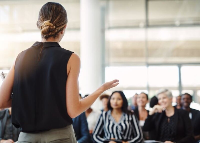 woman speaking at conference