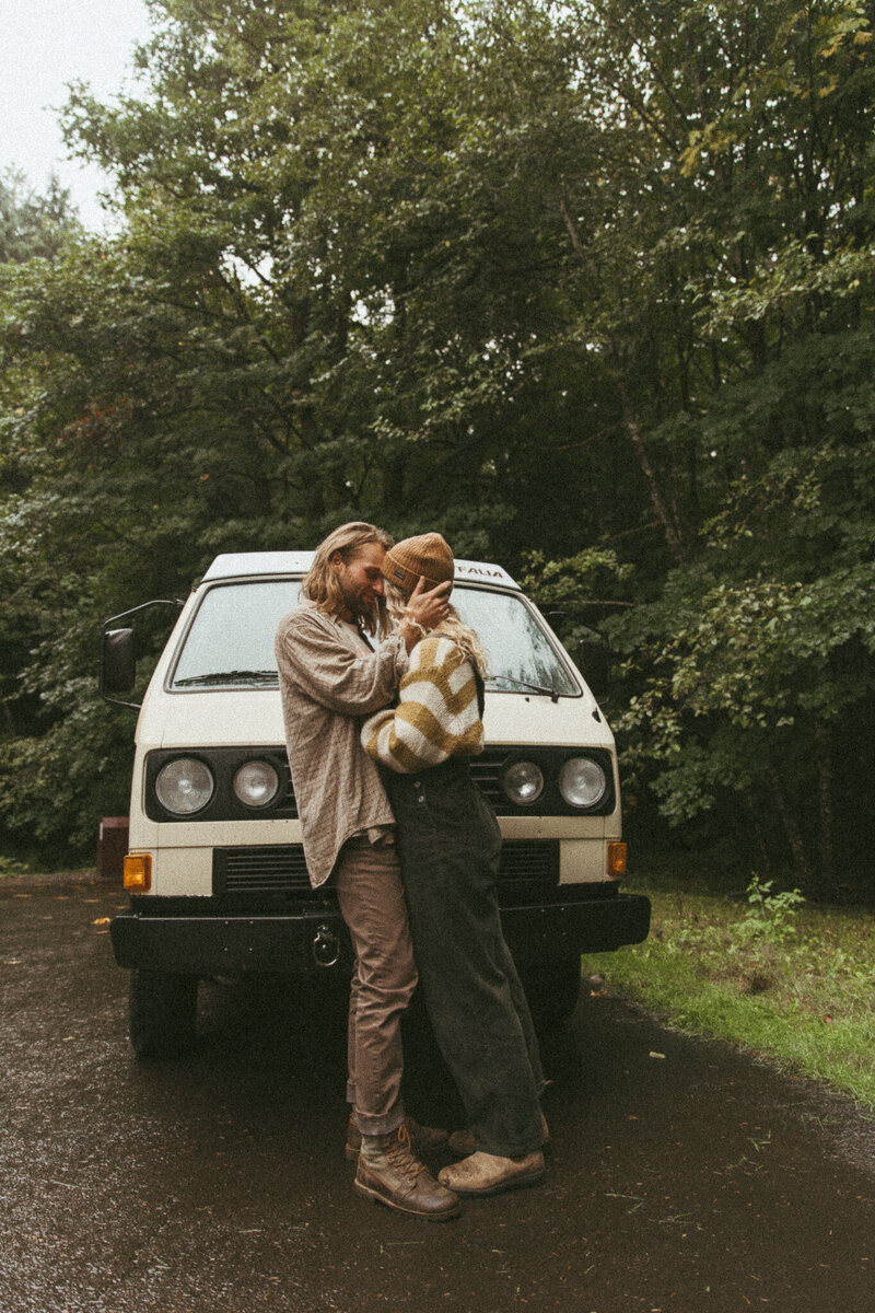 couple holding each other during photo session in Fernie