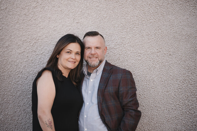 Matthew and Luisia Kidwell standing against a wall smiling - Finance and Communication Coaching at Kidwell Coaching and Consulting 21