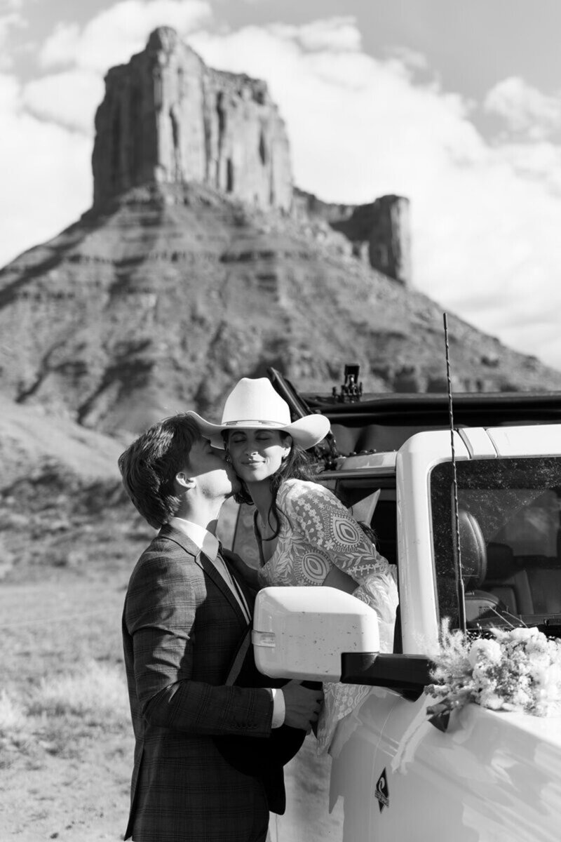 Couple kissing in black and white at their Moab Elopement, photographed by Forever framed by Rachel