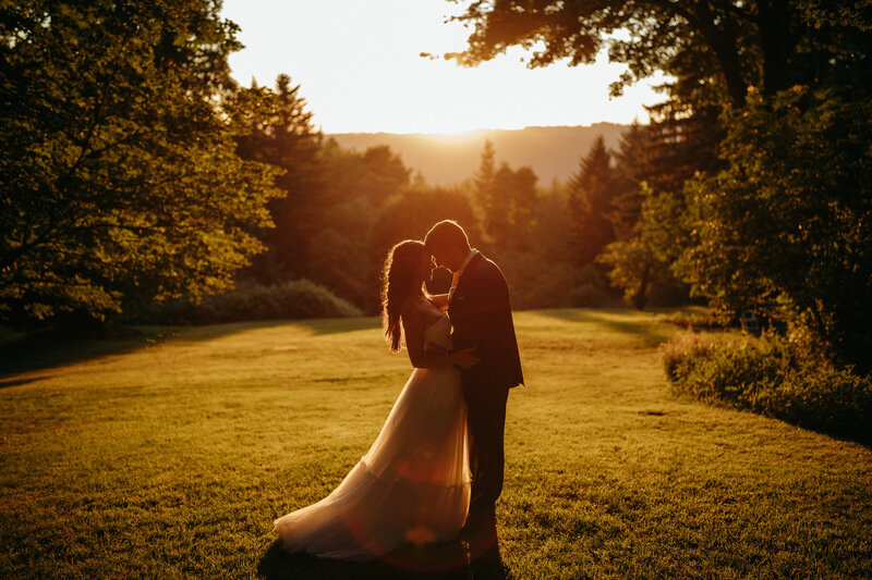 couple embracing at sunset on wedding
