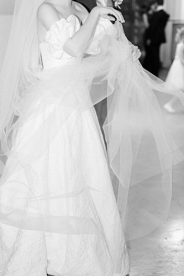 Luxury wedding in Europe – sophisticated bride in a modern wedding gown and groom in a timeless suit.
