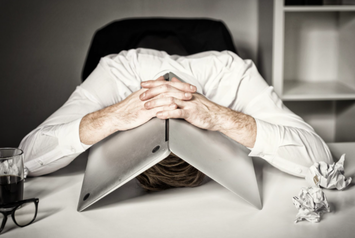 Head under laptop burnout