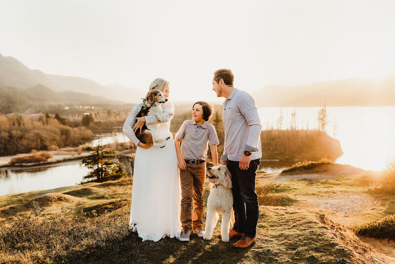A young family is photographed in the Columbia River Gorge with their two dogs 