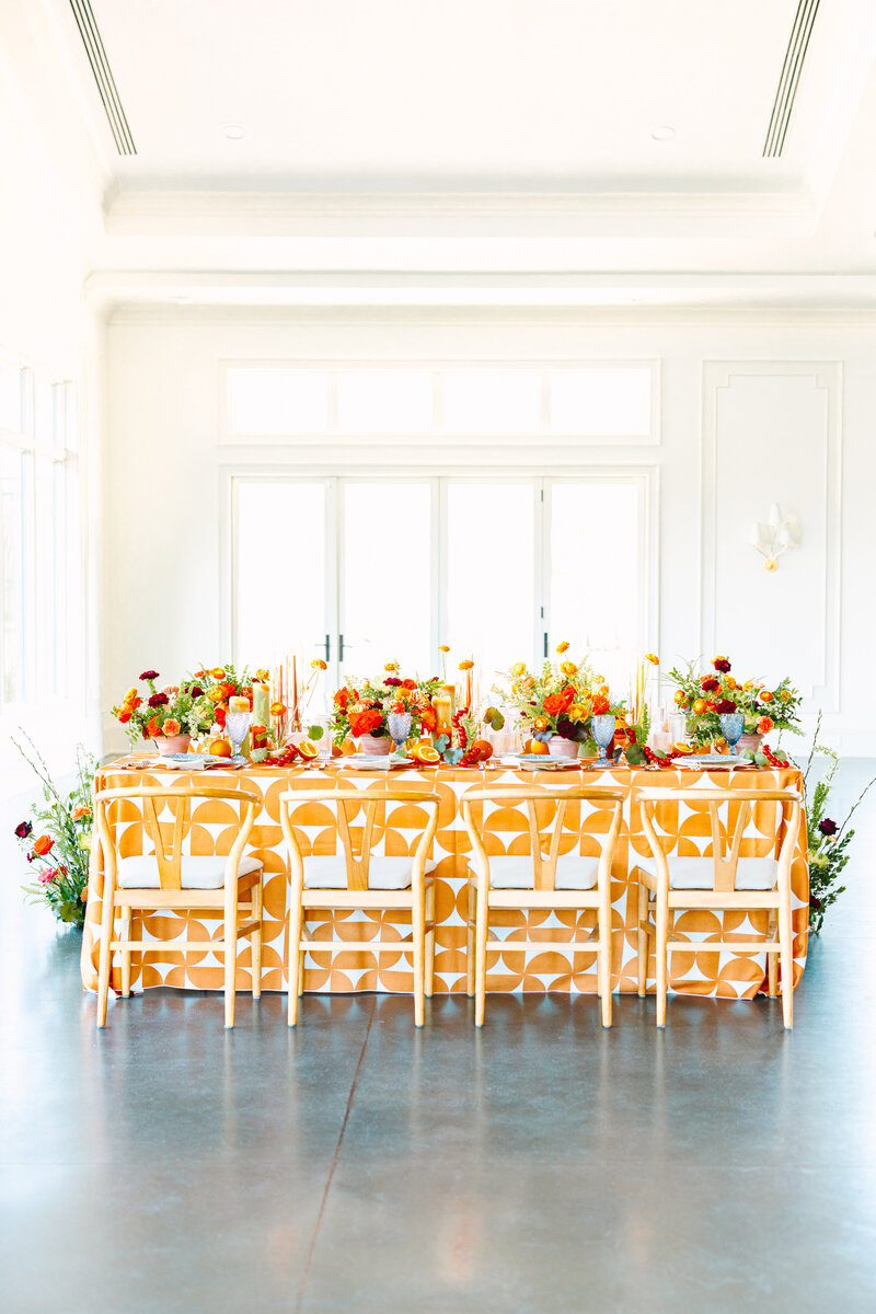 Dinner reception decor with lush florals and luxury rentals