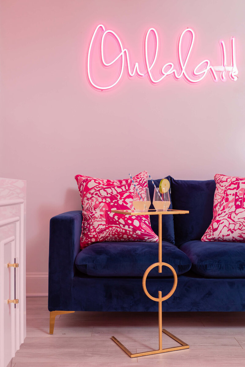 Pink feminine commercial space interior with neon sign