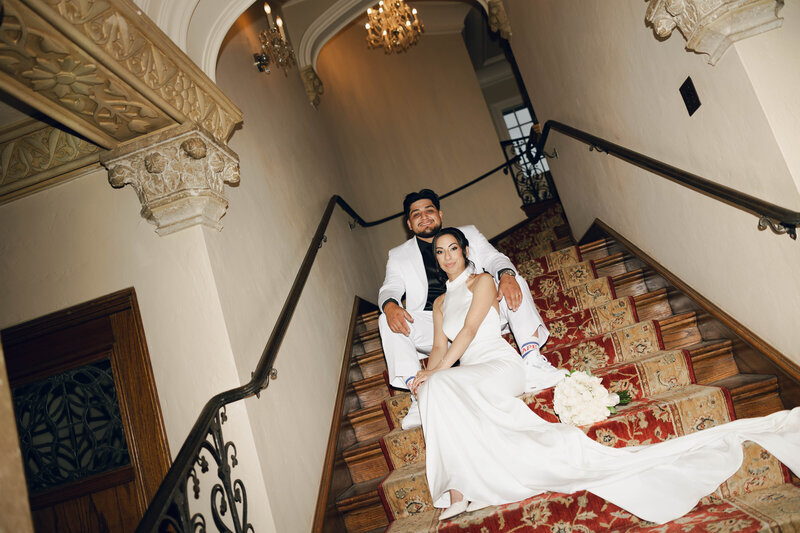 bride and groom ring photo with their wedding flower bouquet