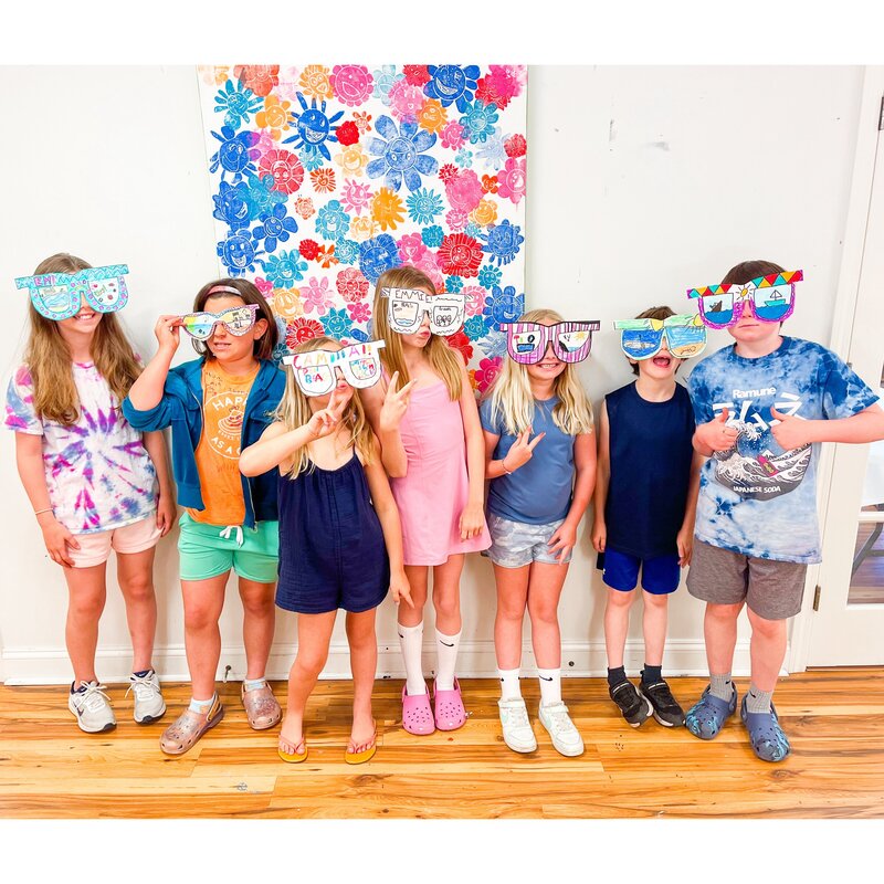 campers at Artcie art studio in paper sunglasses