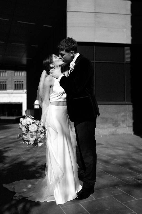 bride and groom kissing for their london wedding photography