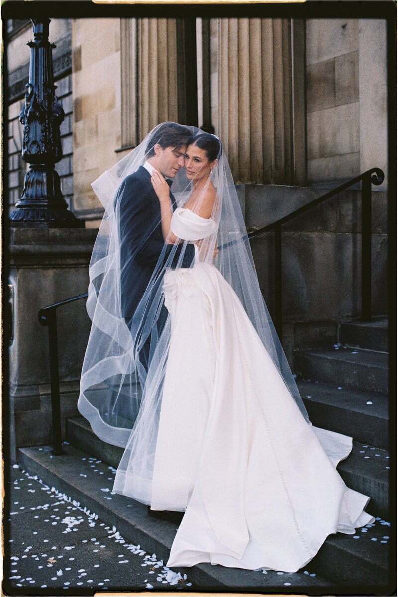 bride and groom kiss in the aisle at wedding in Malta