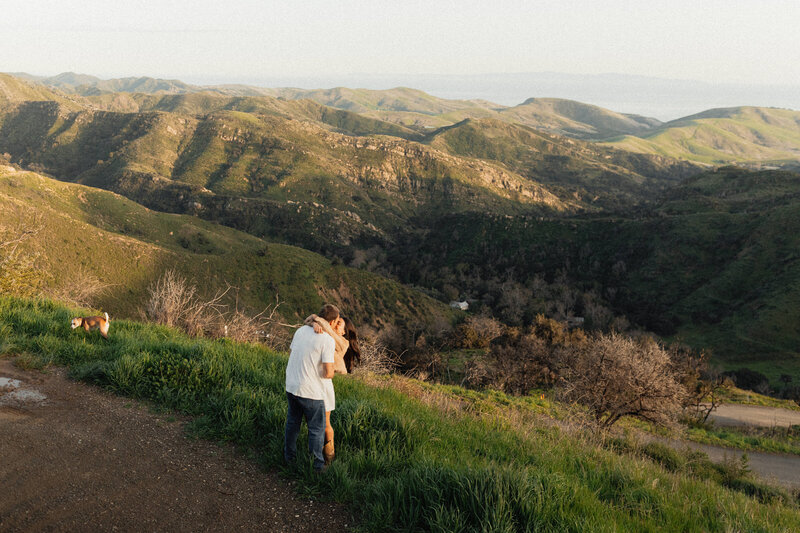 couple kissing in the hills