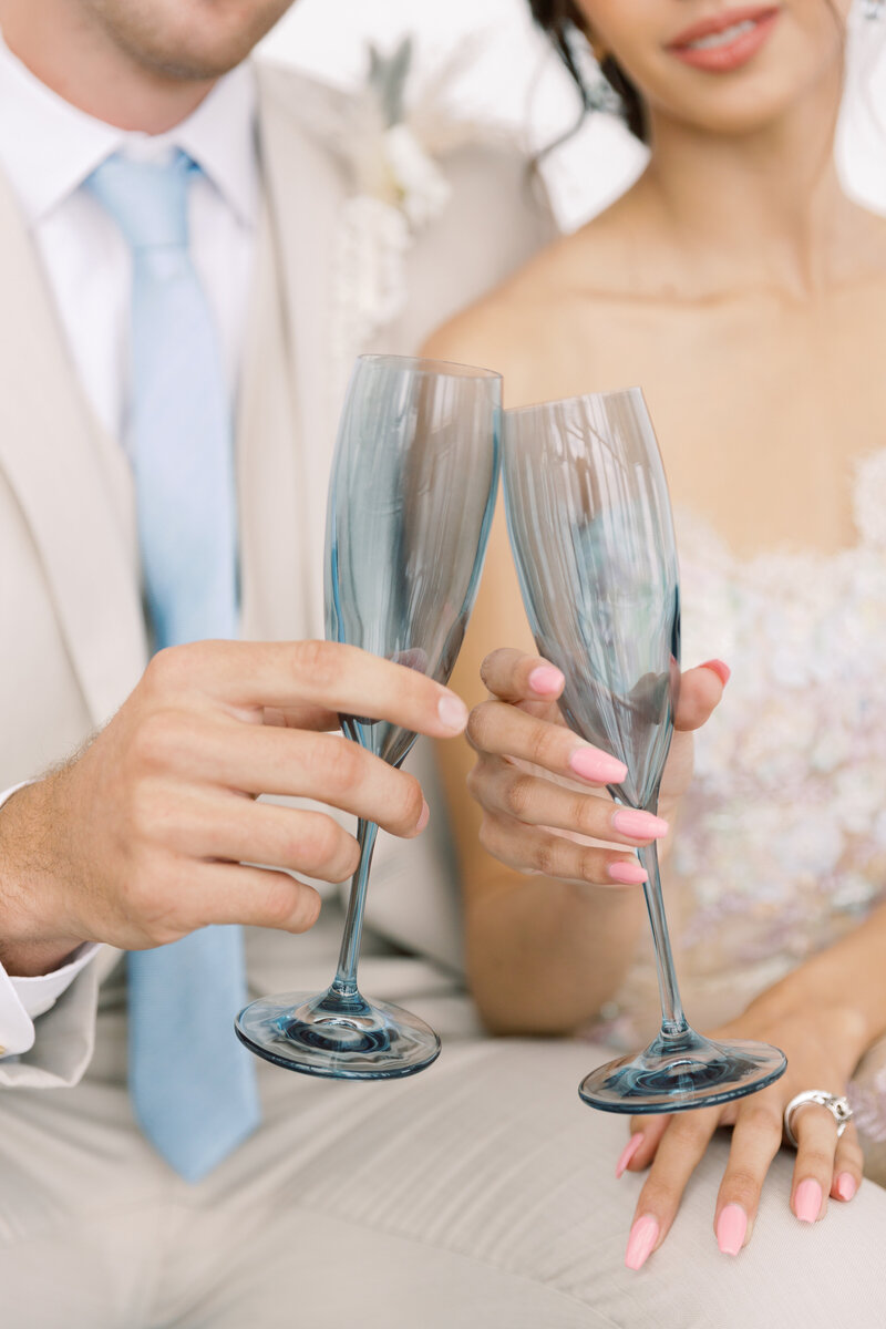 Champagne flutes clink as this newly engaged couple celebrates with a romantic rooftop cocktail.