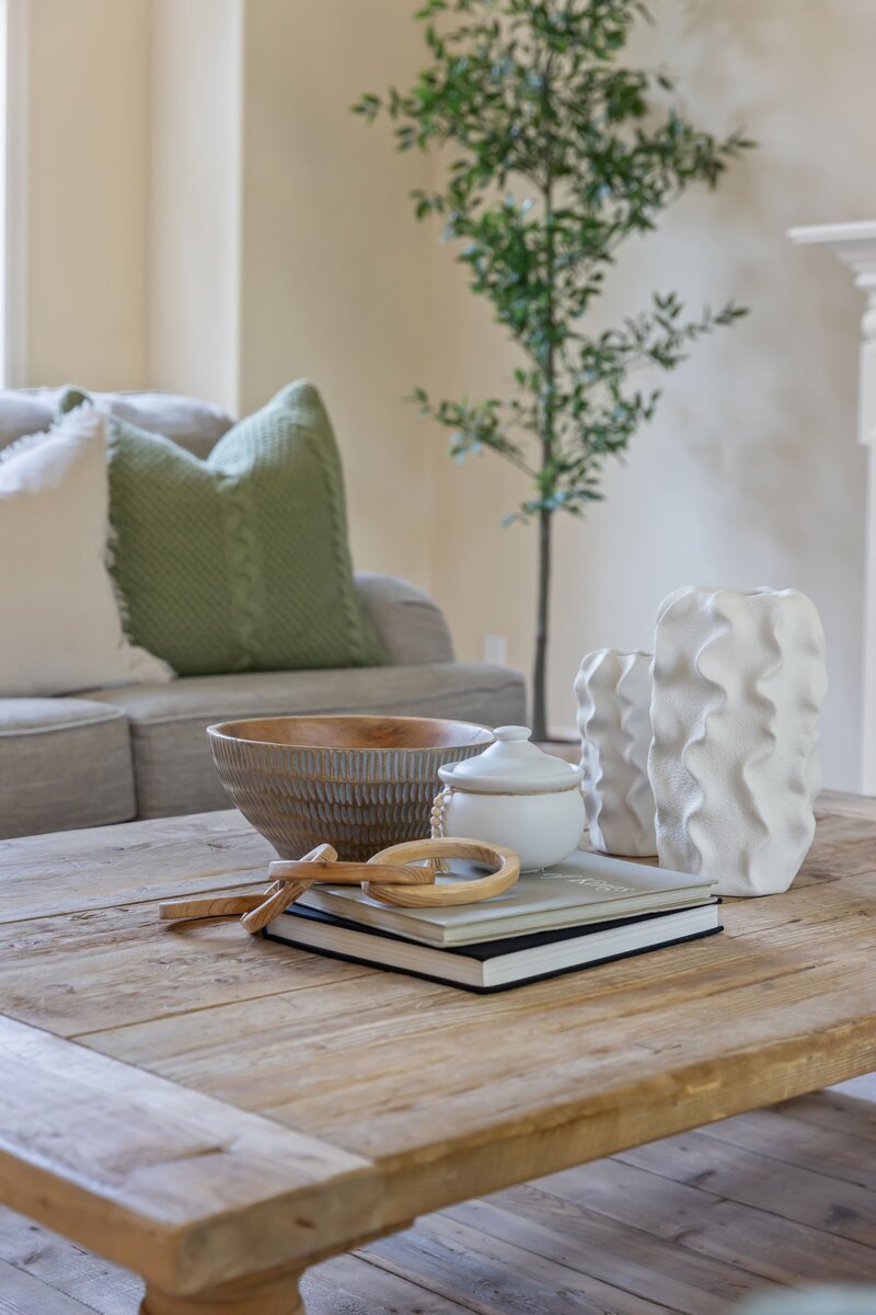 Coffee table styling detail from a Snohomish County home staging project by Modern Mollusk featuring natural textures and neutral décor.
