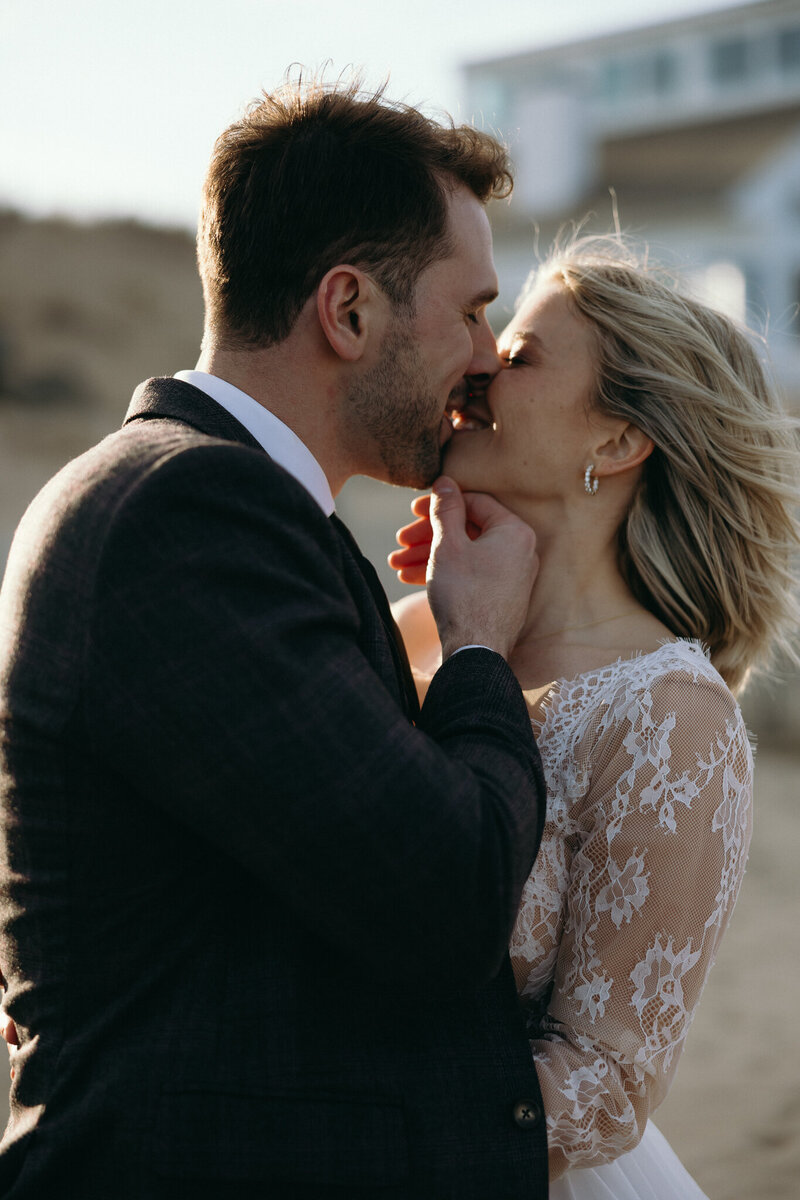 VT Wedding Photographer | Sincerely Liz Photography Documentary Wedding, Engagement, Elopement, Maternity and Newborn Photographer in New England | Bride and groom kiss at a New England beach elopement venue