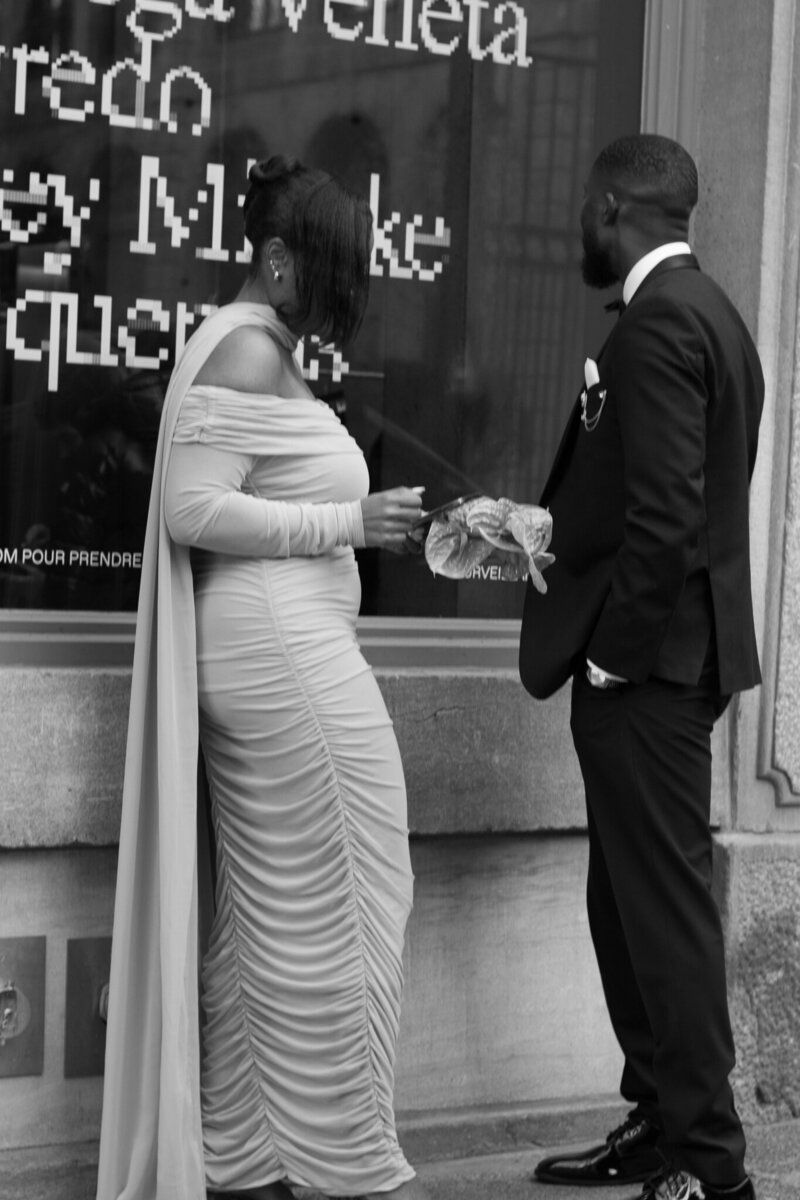 A spontaneous, joy-filled moment of a newlywed couple laughing together in the streets of Old Montreal.