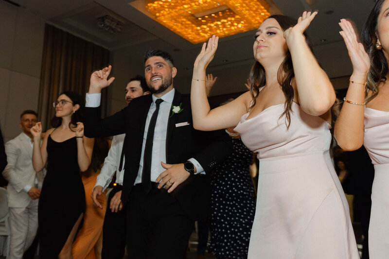 Ottawa wedding photos showing the best man and maid of honour dancing during a Chateau Le Parc wedding reception