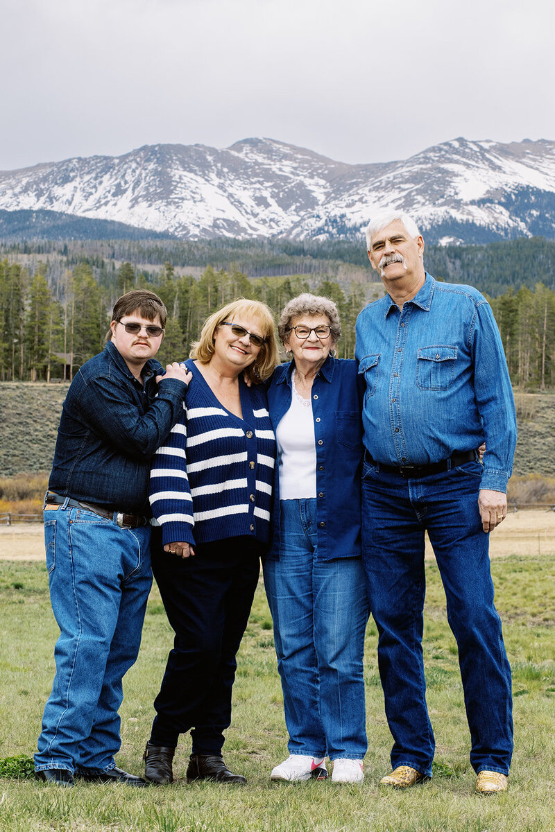 family of 4 pose during a reunion