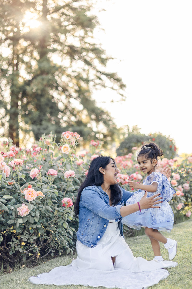 mommy-daughter-playful-rose-garden-golden-hour