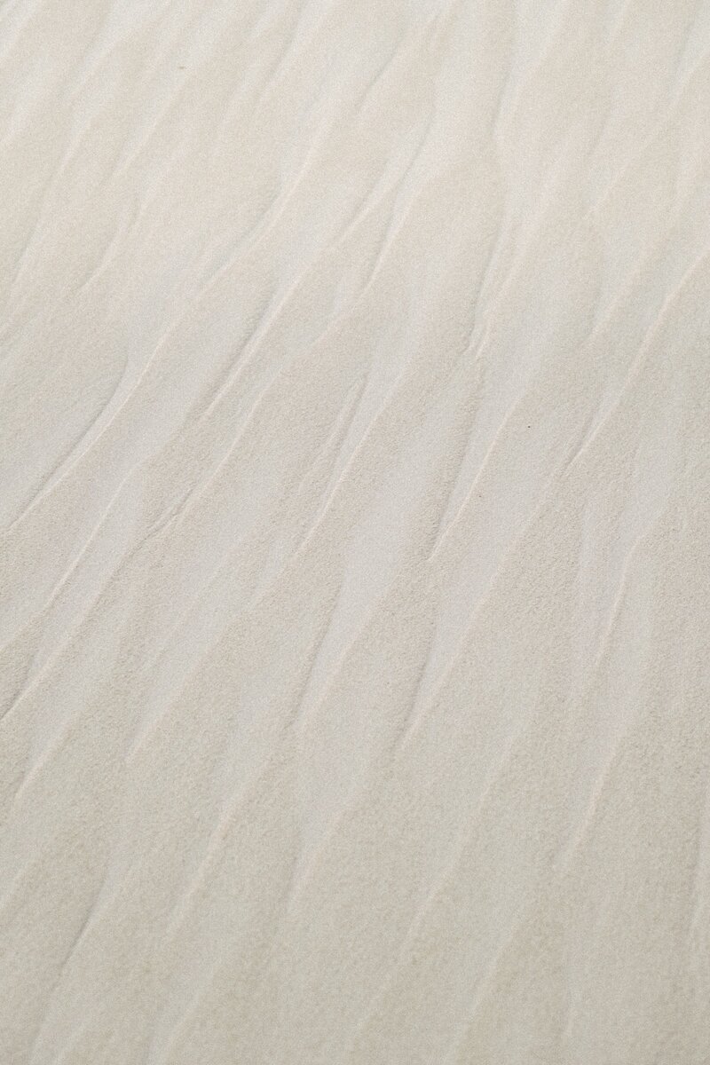 A textured sand surface.