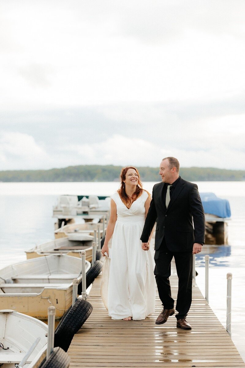 bride and groom photos on a dock on lake michigan