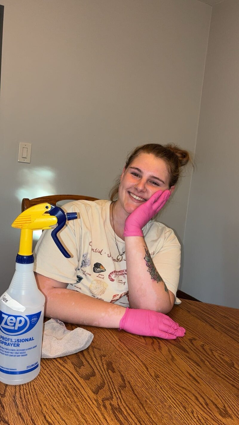 Co-founder scrubbing a countertop during a residential deep clean