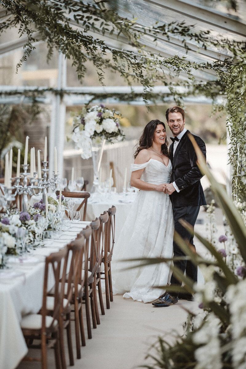 Bride and groom stood in the marquee at Carbis Bay