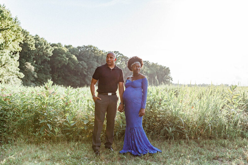 Pregnant couple posing during their maternity session with Asheville wedding photographers.