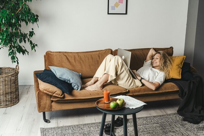 CBT therapy for young adults featuring woman laying on couch