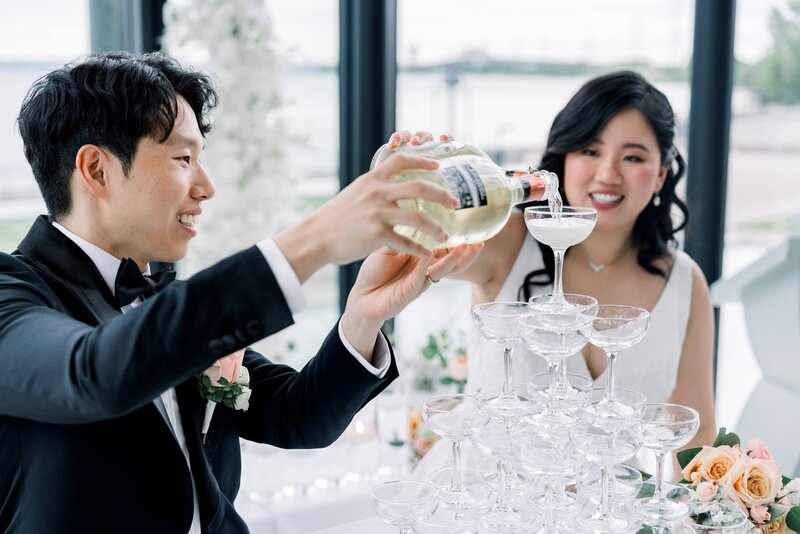 Bride and groom  pouring alcohol