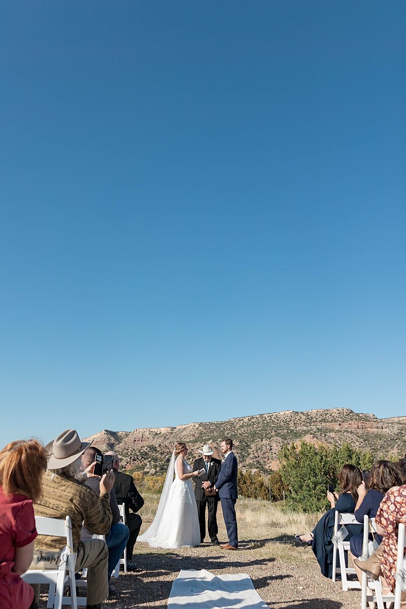 destination-wedding-palo-duro-canyon-texas-couple-dancing-under-the-stars-canyon-view