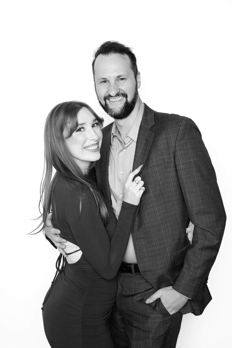 A couple smiles warmly in an elegant black and white portrait captured by Monochrome Portraits, providing luxury photo booth rentals for weddings in Phoenix and Scottsdale.