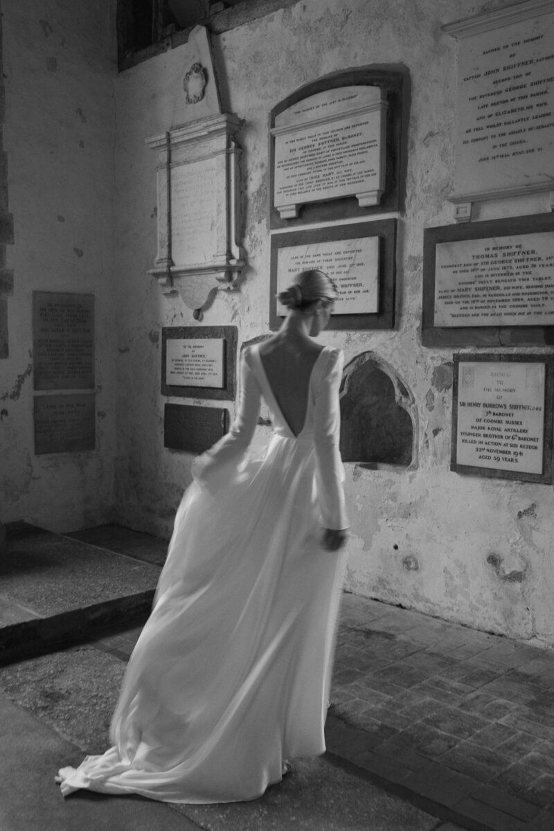 British designer silk wedding dress, bride wearing long, silk dress in church