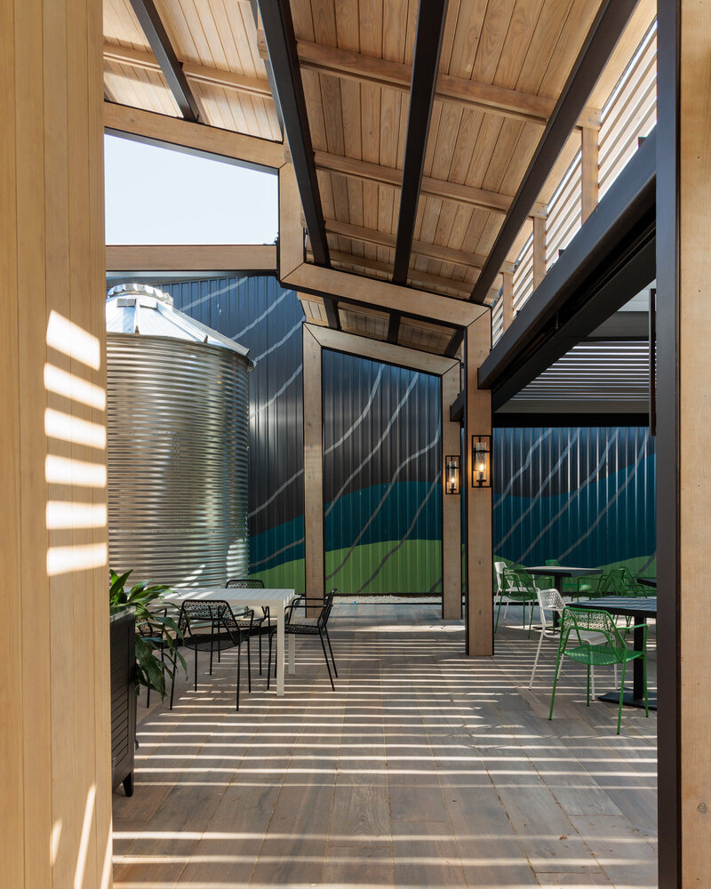 water tank behind an outdoor eating area