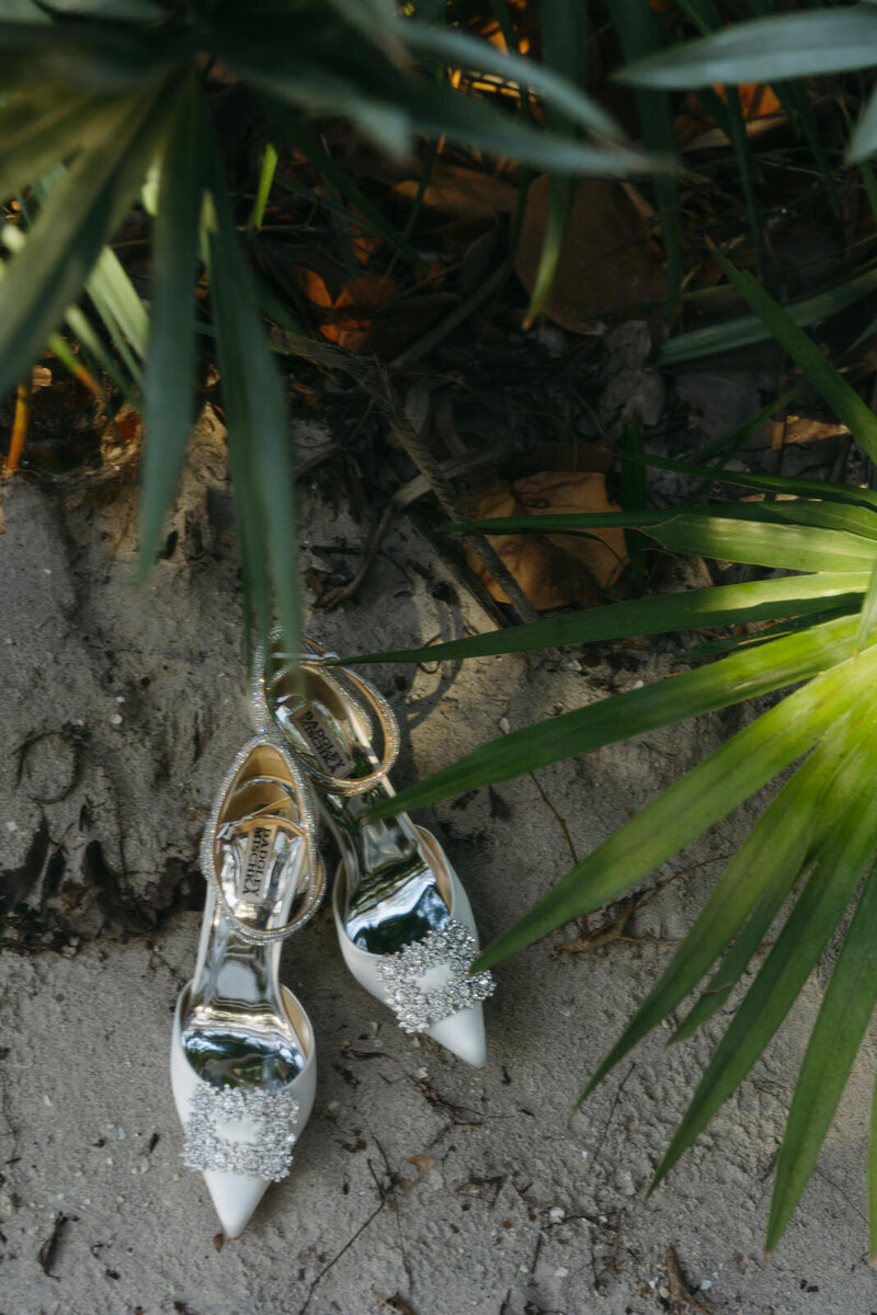 Badgley Mishka wedding heels detail photos on a Miami Florida beach with palms for a Bride's bridal portraits, by Andrea-Marie Photography
