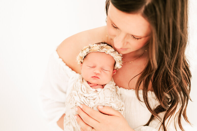 Springfield MO newborn photographer Jessica Kennedy of The Xo Photography captures mom looking down on baby sleeping on her chest