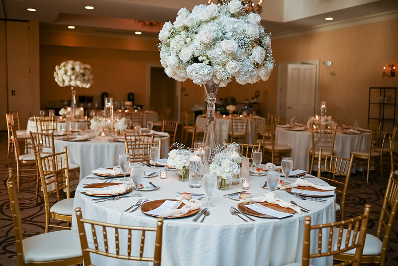 Blue and white wedding table with florals