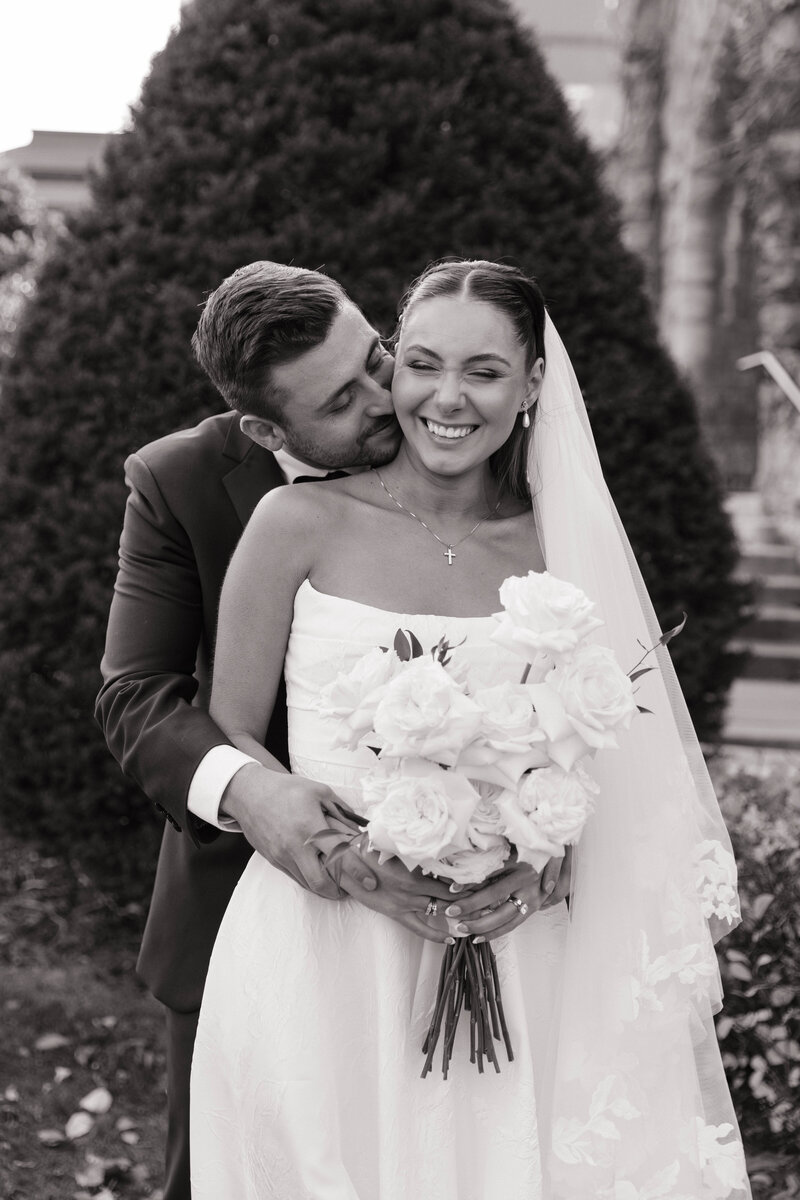 groom kissing bride 