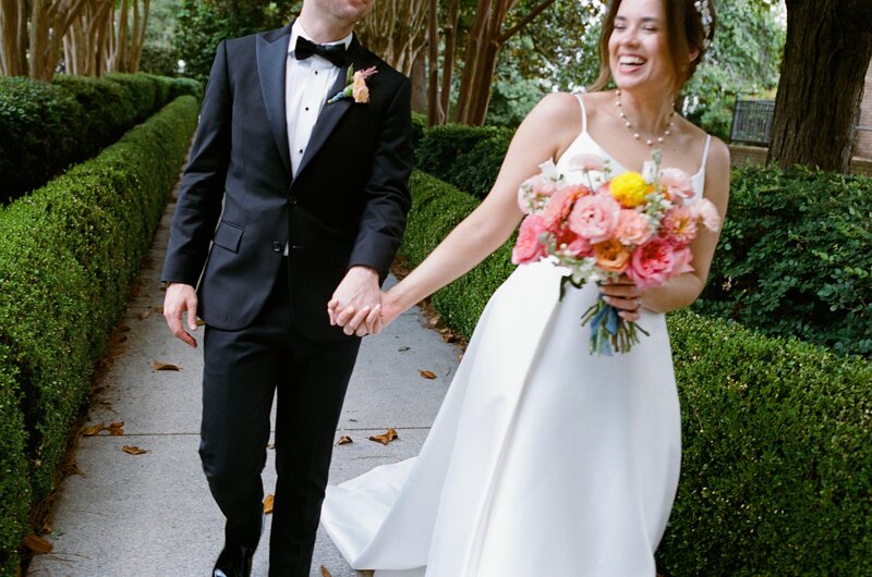 Couple posing in the woods after getting married