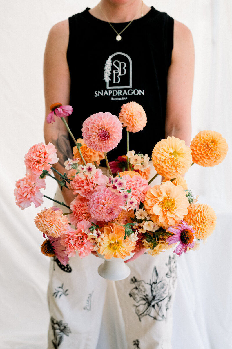 Colorful vibrant flower arrangement designed by Snapdragon Bloom Bar for a Royal Palms Wedding.
