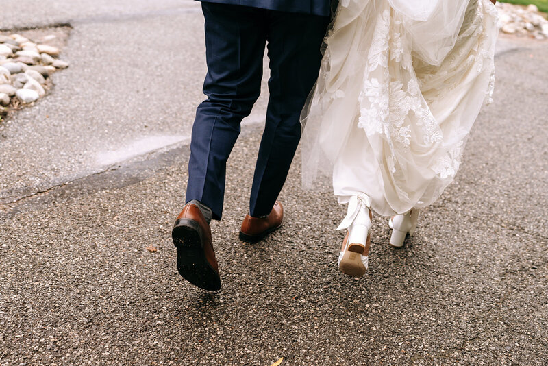 bride and groom blurry feet running