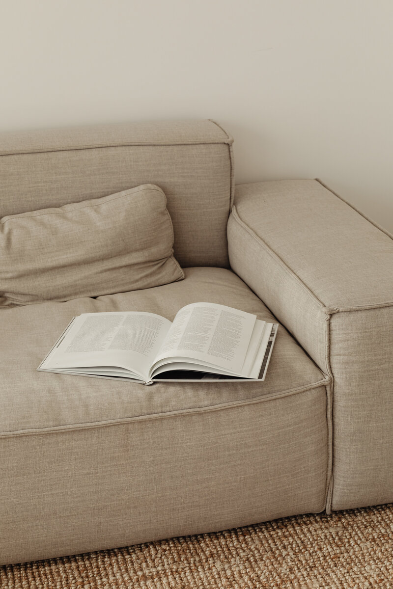 kaboompics_open-book-on-the-couch-magazine-30364