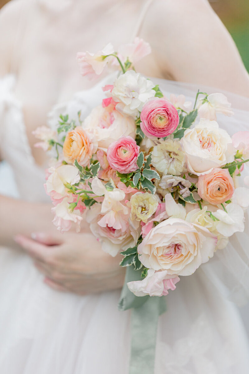 close up of bride holding a bouquet