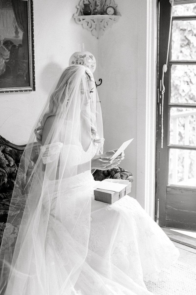 Tiffany Longeway Photography captures a tender and emotional moment as the bride reads a heartfelt letter at The Madrona in Healdsburg, California. The historic charm and elegant setting provide a perfect backdrop for this intimate scene, ideal for couples seeking a romantic and timeless venue for their wedding celebration.