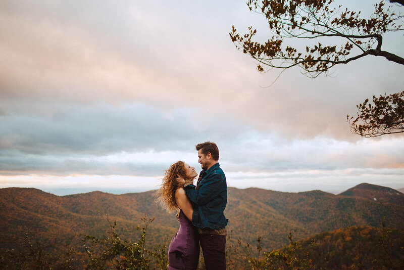couple looking into each others eyes in the fall