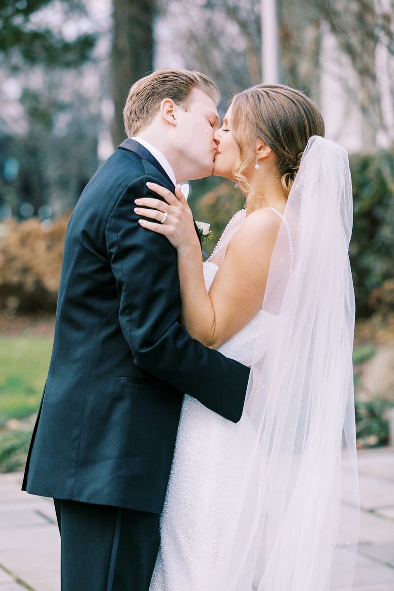 Bride and groom kissing