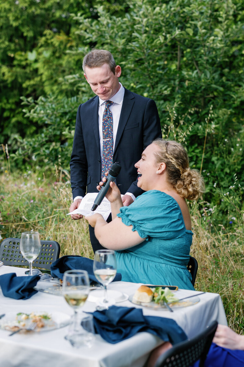 bay area photographers photographs speeches for outdoor wedding reception with blue backyard wedding decor