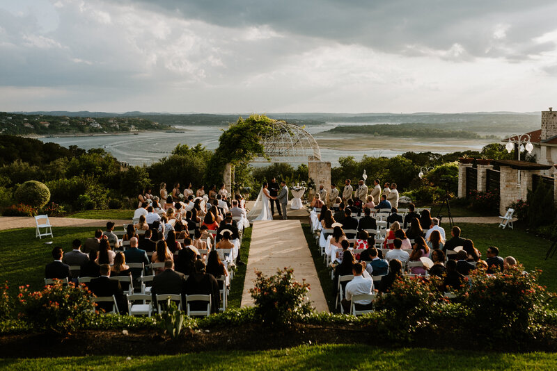 wide photo of ceremony overlooking lake